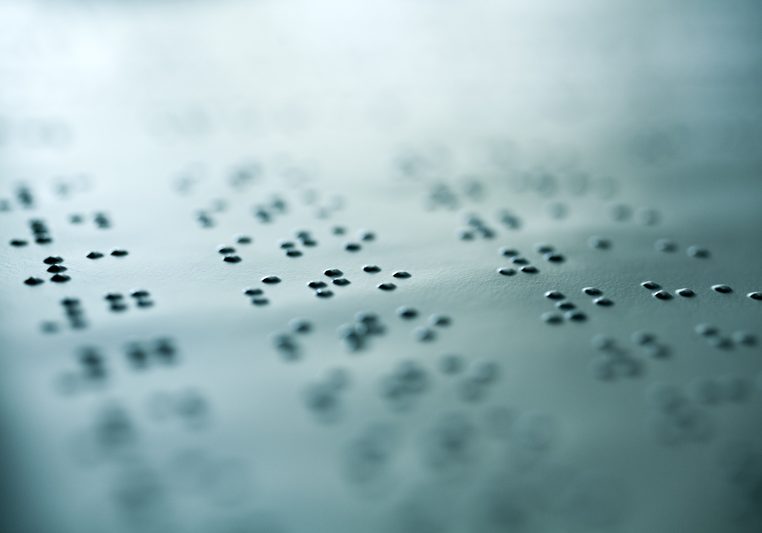 Plain Braille Page Macro. Close up of paper with braille text