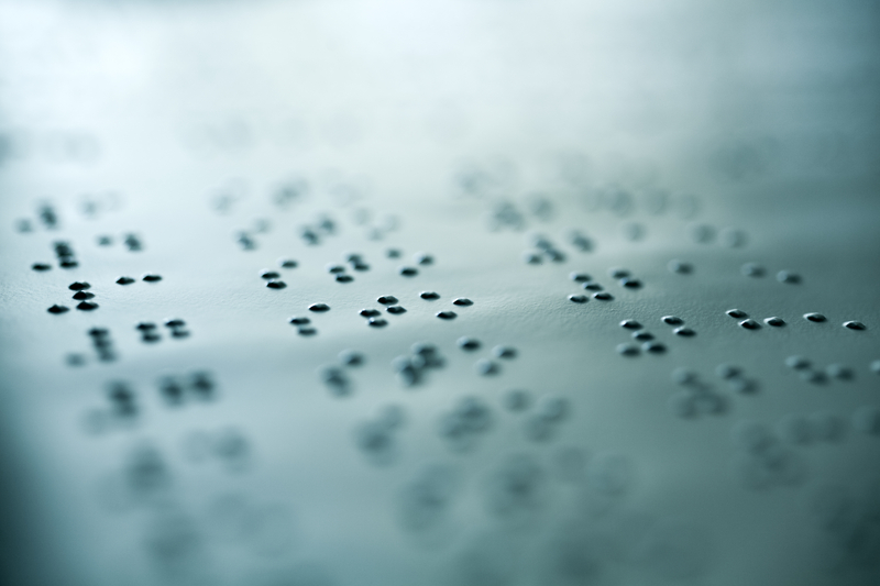 Plain Braille Page Macro. Close up of paper with braille text